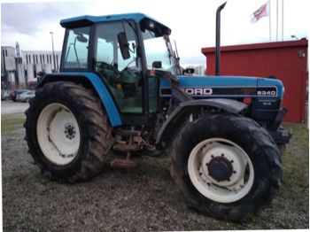 Колёсный трактор New Holland 8340 SLE + chargeur Faucheux
