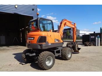 Колёсный экскаватор Doosan DX55W: фото 1 Колёсный экскаватор Doosan DX55W: фото 1