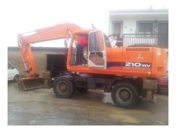 Колёсный экскаватор Daewoo Doosan 210 WV: фото 1 Колёсный экскаватор Daewoo Doosan 210 WV: фото 1