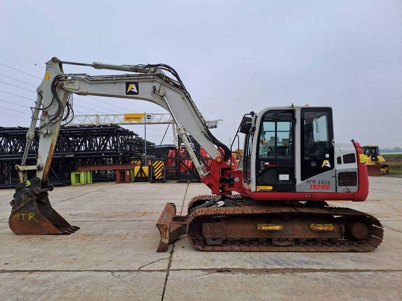 Takeuchi TB2150 - Гусеничный экскаватор: фото 1 Takeuchi TB2150 - Гусеничный экскаватор: фото 1