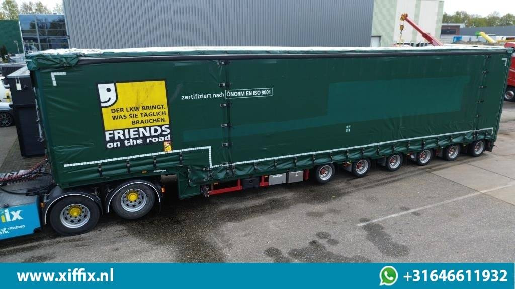 Meusburger 6-ass. Semi dieplader met elektrische huifopbouw / 3x naloop gestuurd - Низкорамный полуприцеп: фото 1 Meusburger 6-ass. Semi dieplader met elektrische huifopbouw / 3x naloop gestuurd - Низкорамный полуприцеп: фото 1