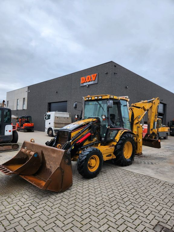 CAT 428D  - Экскаватор-погрузчик: фото 1