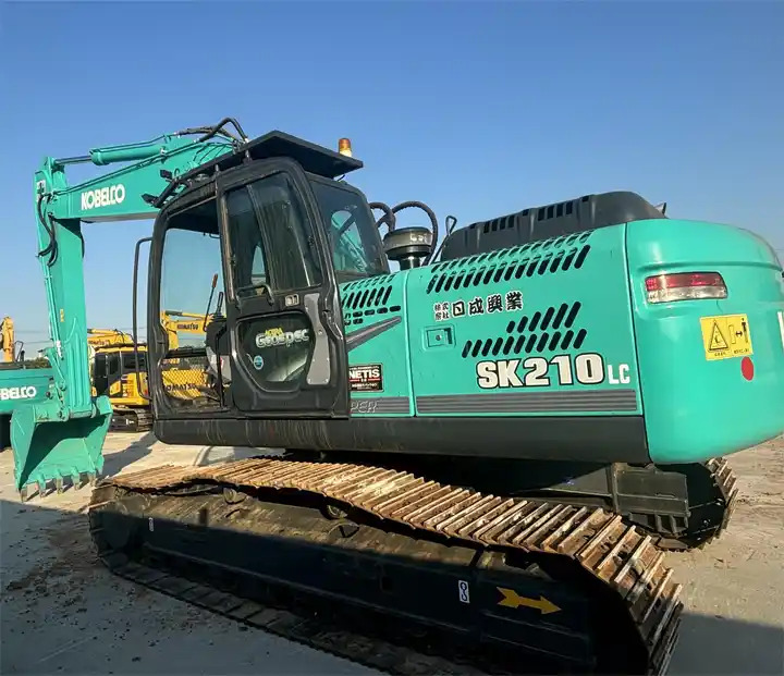 Japan Surplus Construction Excavator Kobelco Sk210 Sk230 Crawler Excavator With Hammer Pipe In Shanghai - Гусеничный экскаватор: фото 1 Japan Surplus Construction Excavator Kobelco Sk210 Sk230 Crawler Excavator With Hammer Pipe In Shanghai - Гусеничный экскаватор: фото 1