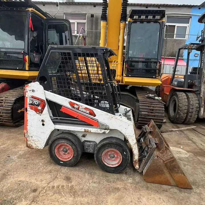Used Powerful Performance Bobcat S70 mini Skid Steer Loader With Shovel Bucket ON SALE - Мини-погрузчик с бортовым поворотом: фото 1 Used Powerful Performance Bobcat S70 mini Skid Steer Loader With Shovel Bucket ON SALE - Мини-погрузчик с бортовым поворотом: фото 1