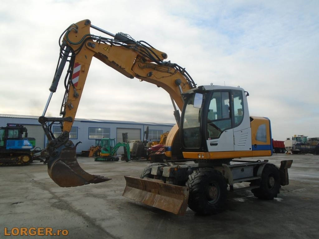 Liebherr A 914 Compact - Колёсный экскаватор: фото 1 Liebherr A 914 Compact - Колёсный экскаватор: фото 1