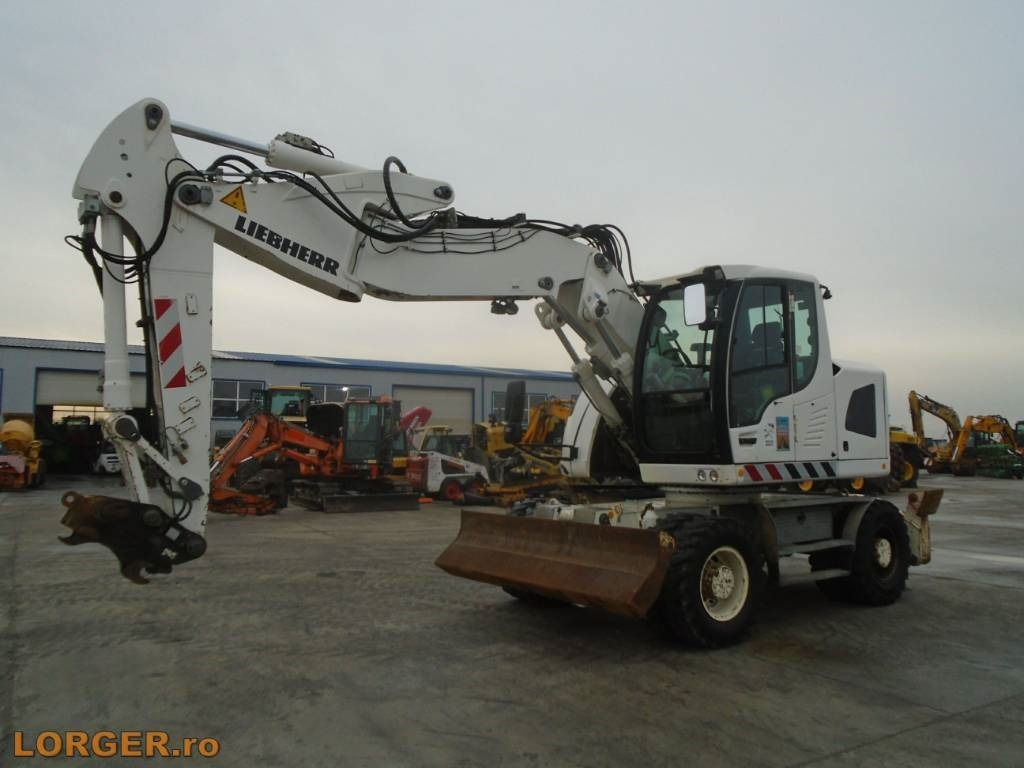 Liebherr A 918 Compact - Колёсный экскаватор: фото 1 Liebherr A 918 Compact - Колёсный экскаватор: фото 1