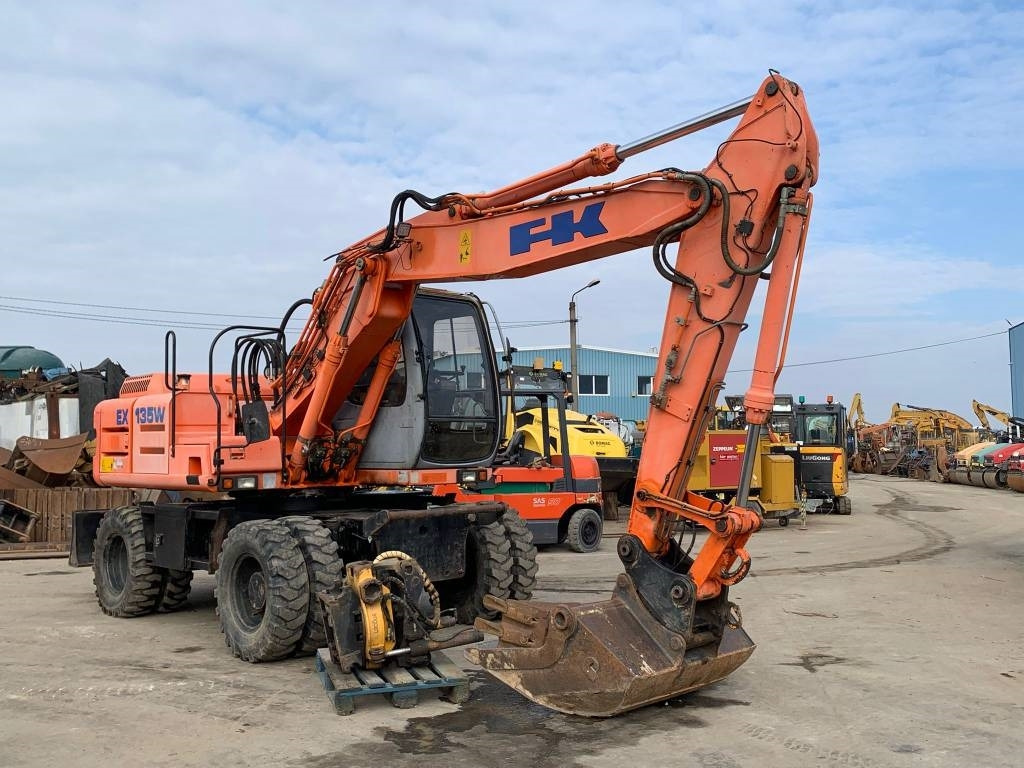 Fiat-Kobelco EX135W+Rototilt - Колёсный экскаватор: фото 1 Fiat-Kobelco EX135W+Rototilt - Колёсный экскаватор: фото 1
