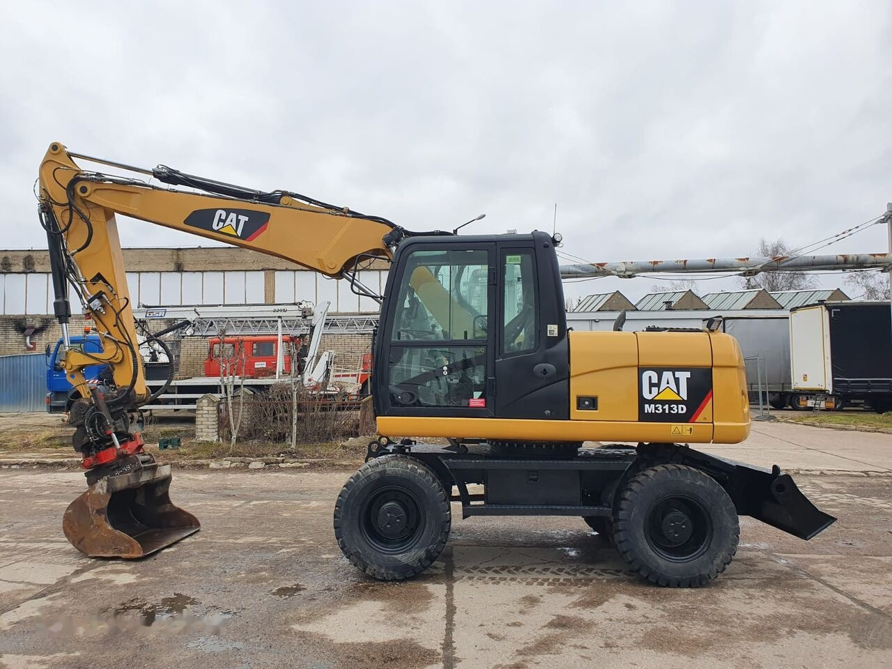 Caterpillar M 313 D Tiltrotator - Колёсный экскаватор: фото 1