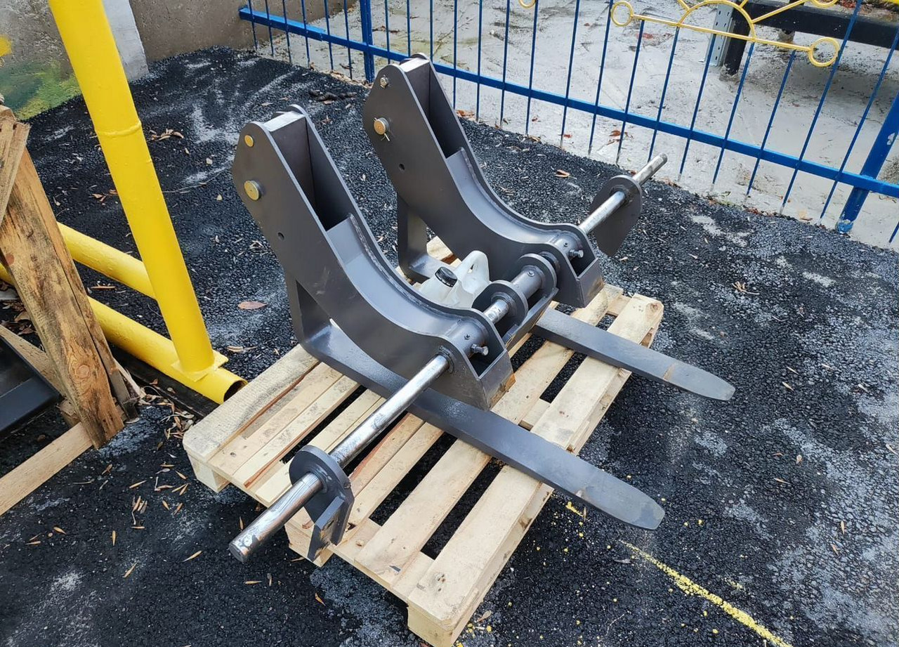 Паллетные вилы откидные нa экcкaватор-погрузчик - Вилы для Строительной техники: фото 1 Паллетные вилы откидные нa экcкaватор-погрузчик - Вилы для Строительной техники: фото 1