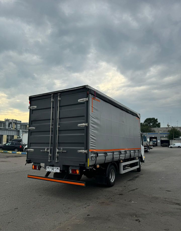 Новый Тентованный грузовик Isuzu Elf: фото 6 Новый Тентованный грузовик Isuzu Elf: фото 6