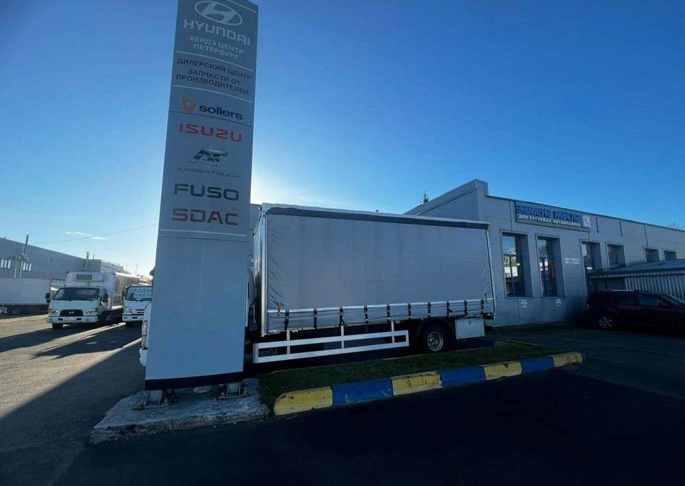 Isuzu Elf - Тентованный грузовик: фото 3 Isuzu Elf - Тентованный грузовик: фото 3