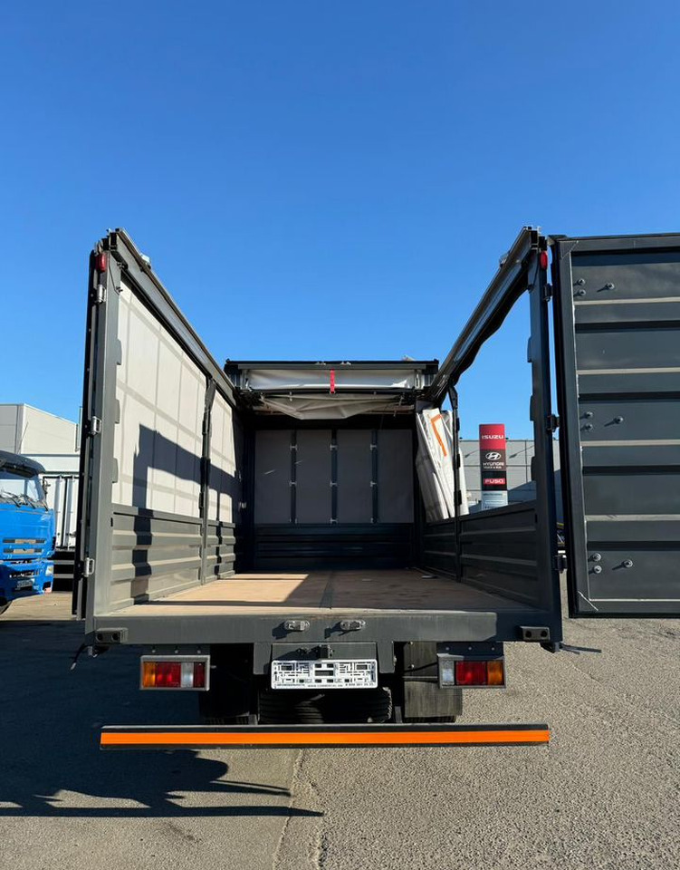 Новый Тентованный грузовик Isuzu Elf: фото 13 Новый Тентованный грузовик Isuzu Elf: фото 13