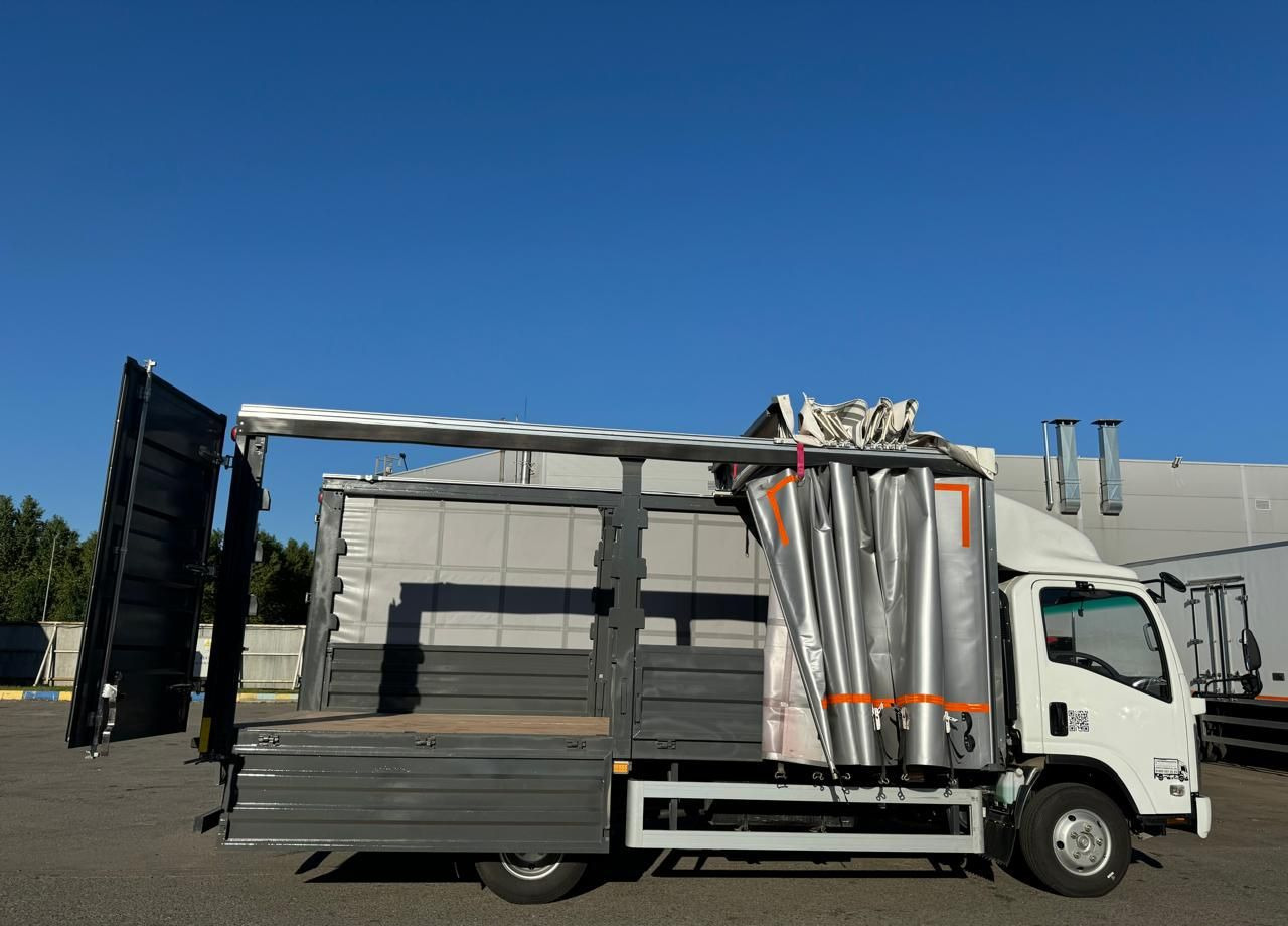 Новый Тентованный грузовик Isuzu Elf: фото 14 Новый Тентованный грузовик Isuzu Elf: фото 14