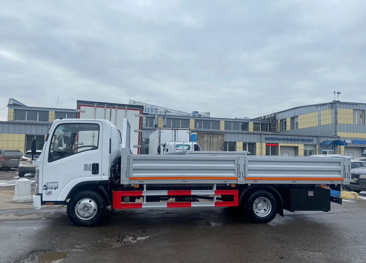 Isuzu Elf - Бортовой грузовик/ Платформа: фото 1 Isuzu Elf - Бортовой грузовик/ Платформа: фото 1