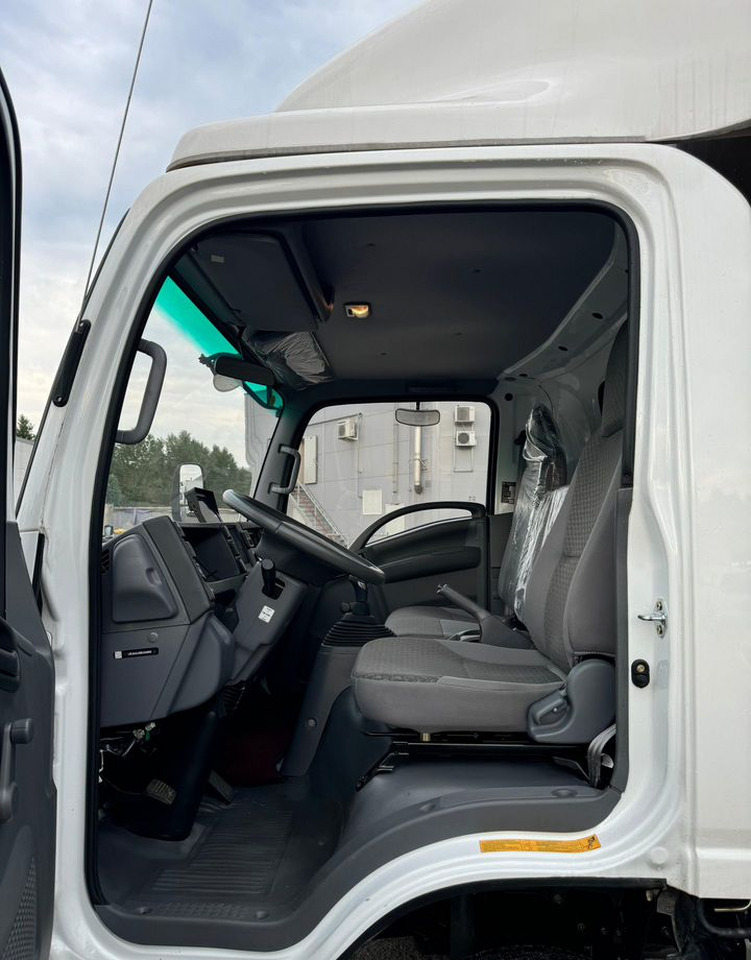 Новый Тентованный грузовик Isuzu Elf: фото 12 Новый Тентованный грузовик Isuzu Elf: фото 12