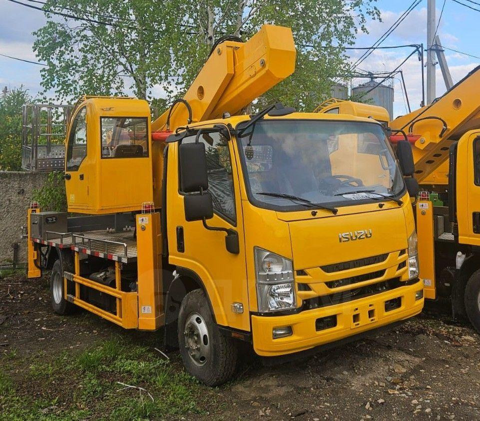 Isuzu Elf - Грузовик с подъемником: фото 1 Isuzu Elf - Грузовик с подъемником: фото 1