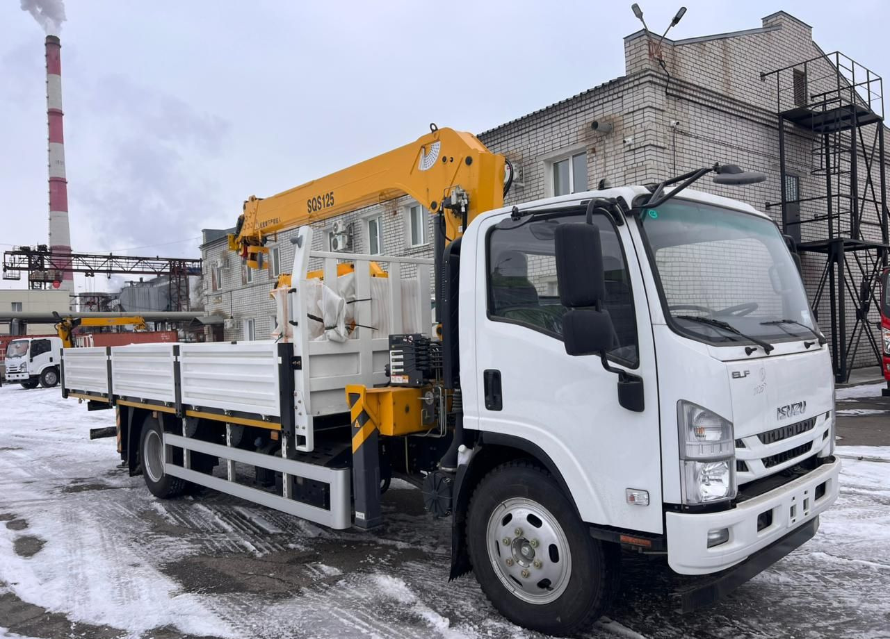 Isuzu Elf (N-series) - Грузовик бортовой/ Платформа, Автоманипулятор: фото 1 Isuzu Elf (N-series) - Грузовик бортовой/ Платформа, Автоманипулятор: фото 1