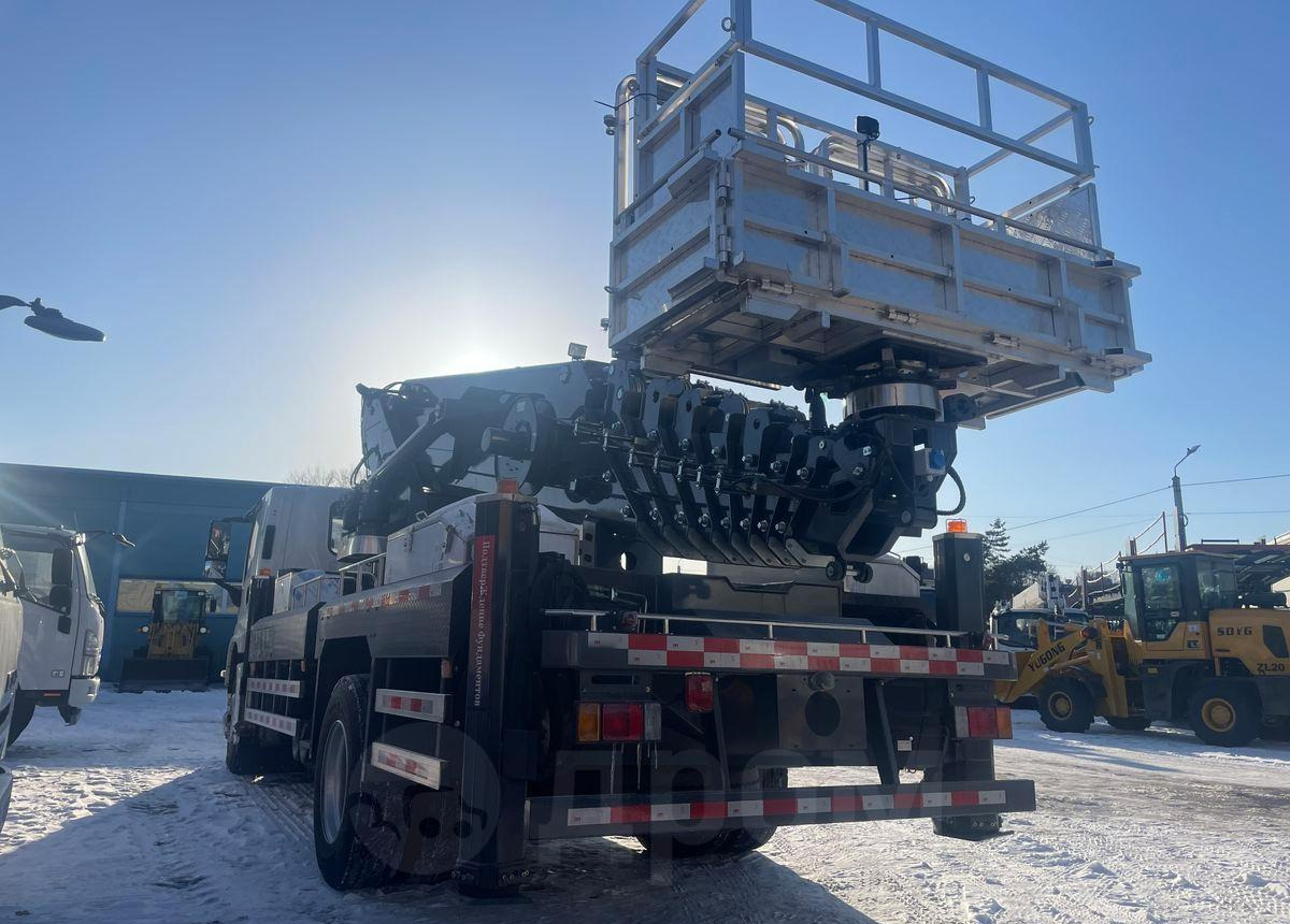 Isuzu Elf - Грузовик с подъемником: фото 5 Isuzu Elf - Грузовик с подъемником: фото 5