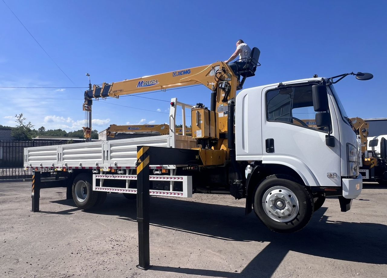 Isuzu Elf (N-series) - Грузовик бортовой/ Платформа, Автоманипулятор: фото 2 Isuzu Elf (N-series) - Грузовик бортовой/ Платформа, Автоманипулятор: фото 2