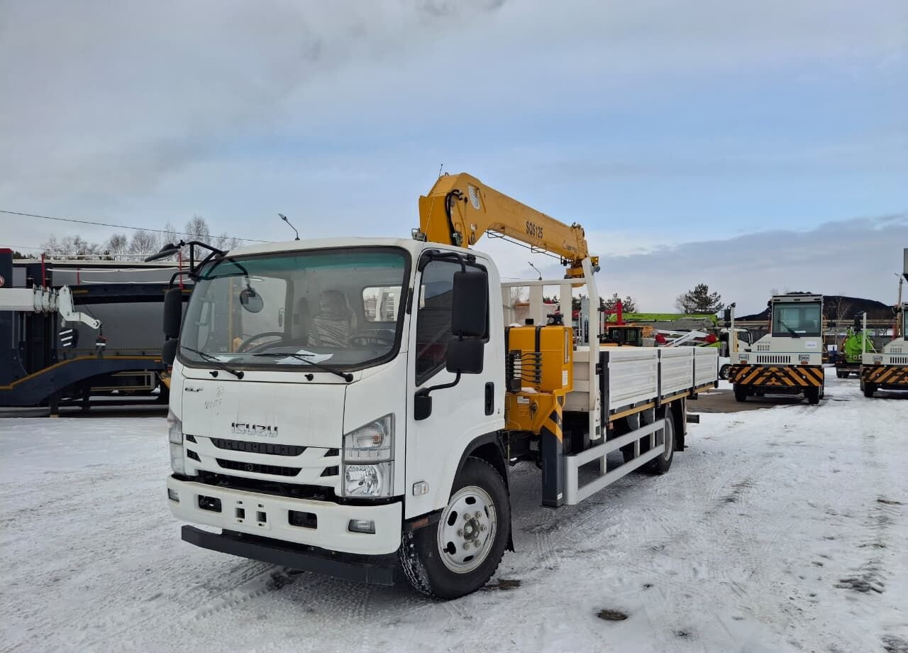 Isuzu Elf - Грузовик бортовой/ Платформа, Автоманипулятор: фото 1 Isuzu Elf - Грузовик бортовой/ Платформа, Автоманипулятор: фото 1