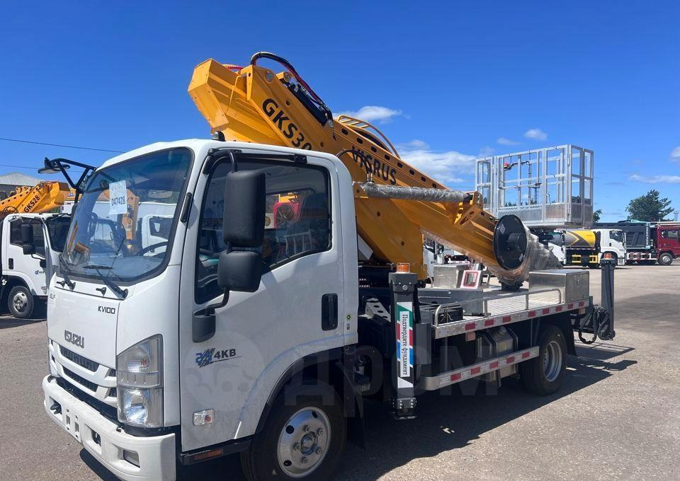 Isuzu Elf - Грузовик с подъемником: фото 2 Isuzu Elf - Грузовик с подъемником: фото 2