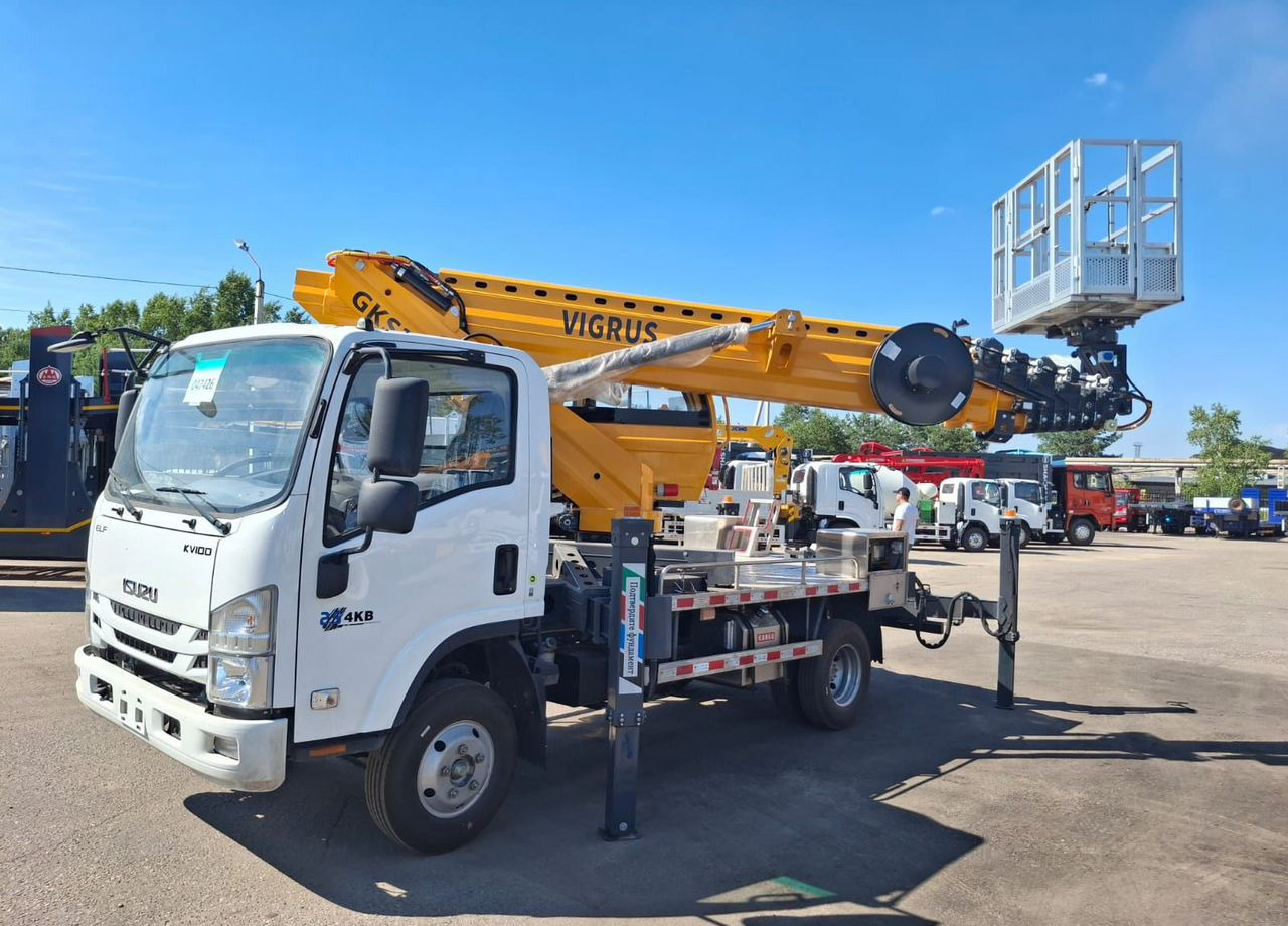 Isuzu Elf - Грузовик с подъемником: фото 2 Isuzu Elf - Грузовик с подъемником: фото 2