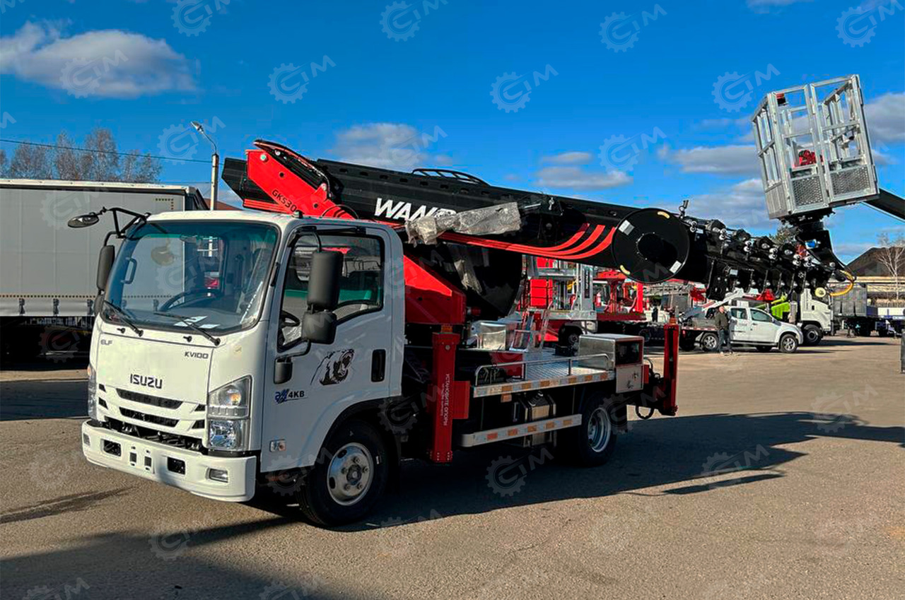 ISUZU Elf - Грузовик с подъемником: фото 1 ISUZU Elf - Грузовик с подъемником: фото 1