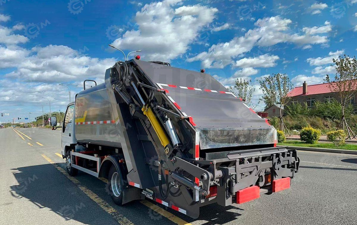 Isuzu Elf - Мусоровоз: фото 1 Isuzu Elf - Мусоровоз: фото 1