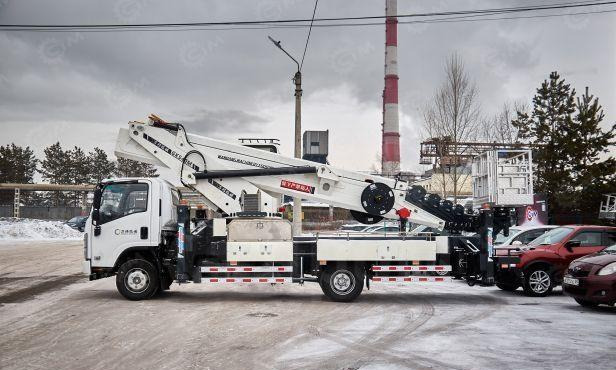 Isuzu Elf - Грузовик с подъемником: фото 3 Isuzu Elf - Грузовик с подъемником: фото 3