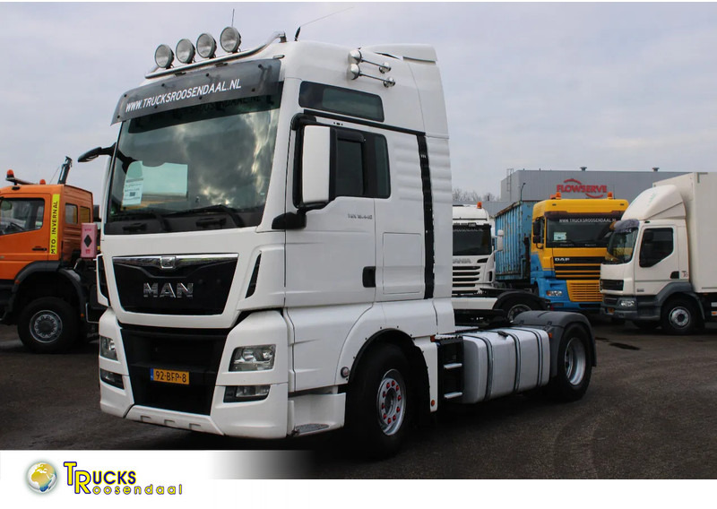 MAN TGX 18.440 + euro 6 + 405km + double tank + spoiler - Тягач: фото 1
