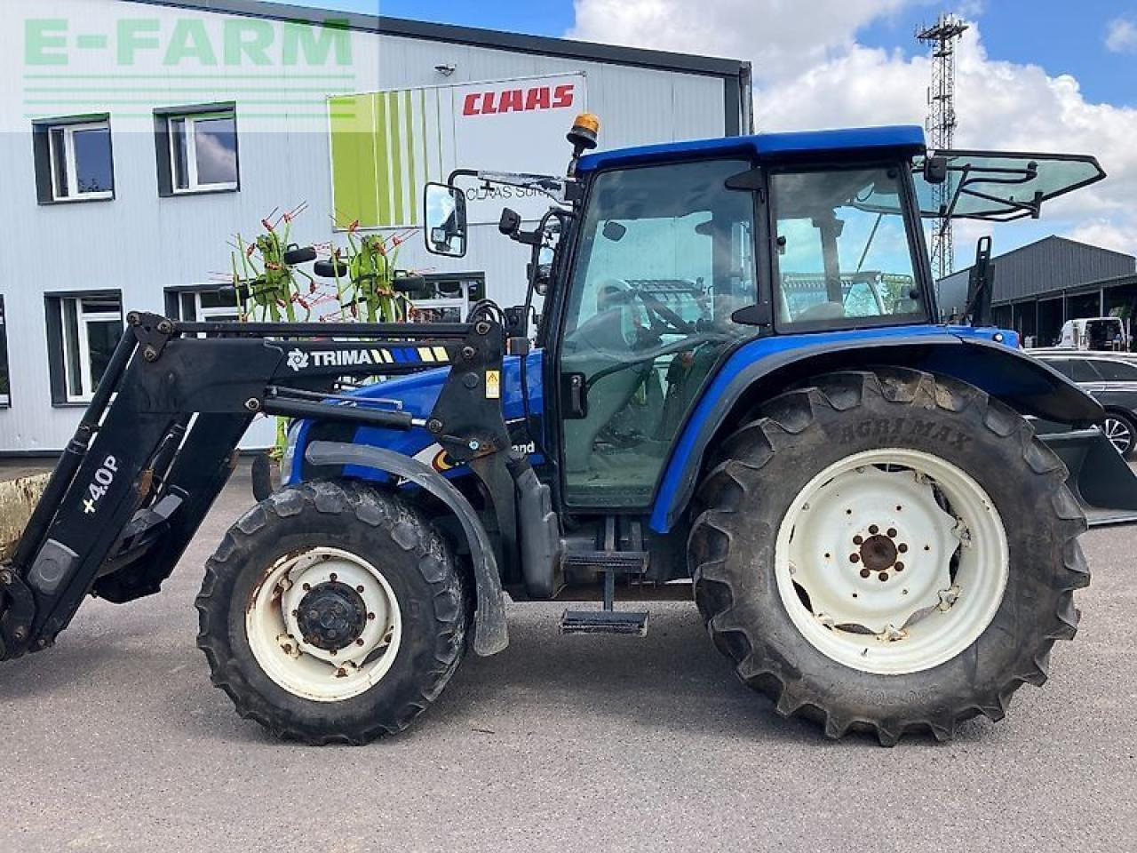 New Holland tl 100 a A - Трактор: фото 1 New Holland tl 100 a A - Трактор: фото 1