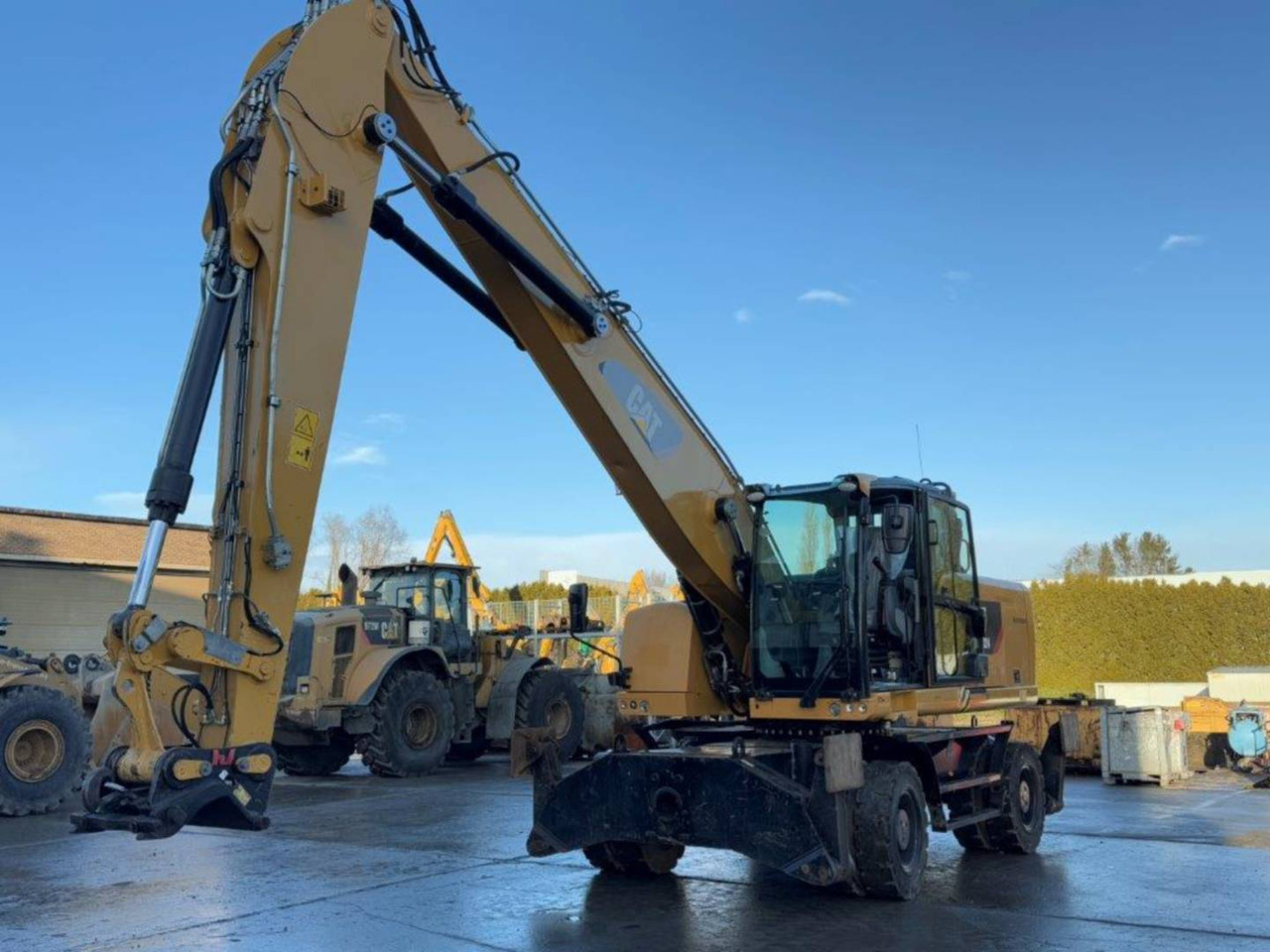 CAT MH3024-06 - Колёсный экскаватор: фото 1 CAT MH3024-06 - Колёсный экскаватор: фото 1
